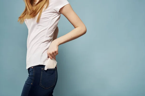 Woman with strip in jeans pocket menstruation critical days — Stock Photo, Image