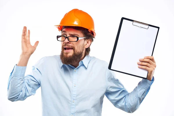Engineer orange helmet safety professional manual in hand cropped view — Stock Photo, Image