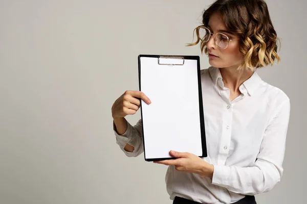 Business woman with folder of documents in hands on gray background cropped view of work — Stock Photo, Image