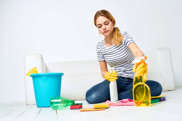 Cleaning lady with detergent in hands in the room housekeeping — Stock Photo, Image