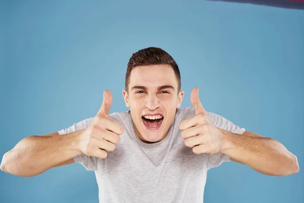 Emotional man in white t-shirt cropped view on blue background lifestyle — Stock Photo, Image