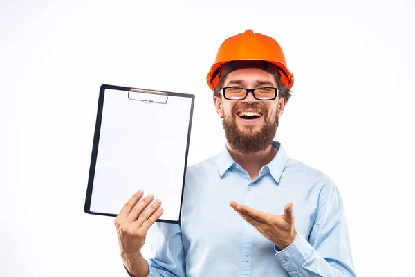 Engineer orange helmet safety professional manual in hand cropped view — Stock Photo, Image