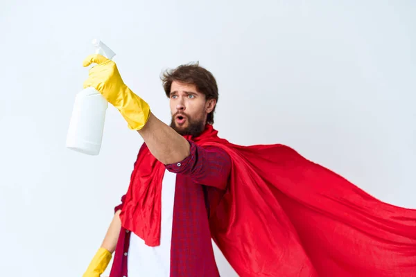 Man with detergent red raincoat professional work