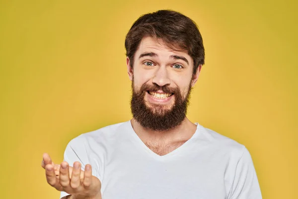 Bearded man in white t-shirt emotions close-up fun yellow background — Stock Photo, Image