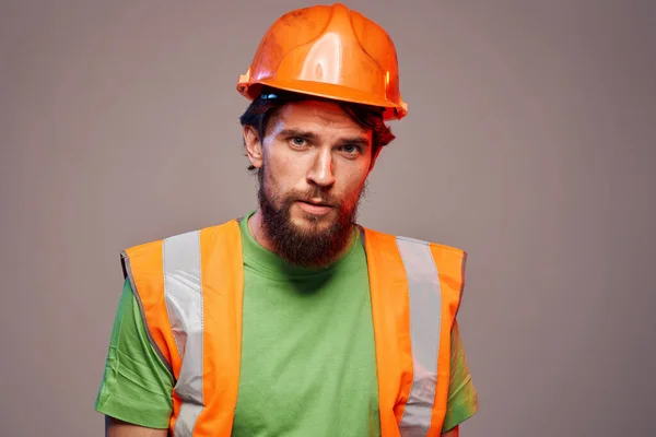 Worker man in orange paint construction security professional