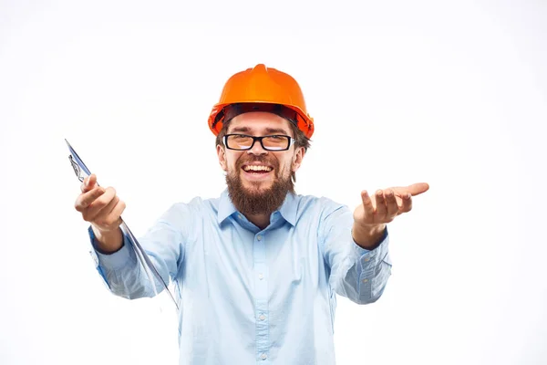 Yrkesutøvere i oransje, harde hattekonstruksjonsdokumenter – stockfoto