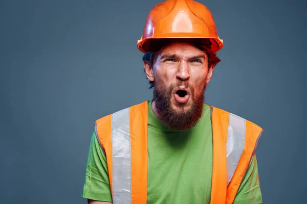 emotional worker orange hard hat construction cropped view