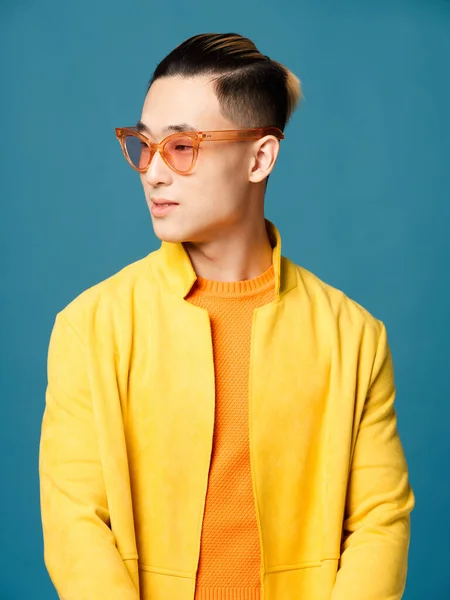 Asian man fashionable hairstyle yellow jacket glasses on his face — Stock Photo, Image