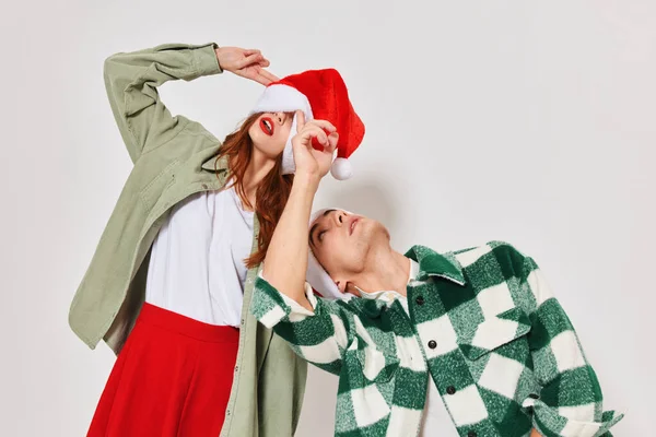 Man and woman Christmas hat Christmas Studio emotions holiday — Stock Photo, Image