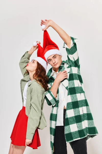 Mann und Frau im neuen Jahr Kleidung Urlaub Weihnachten Licht Hintergrund — Stockfoto