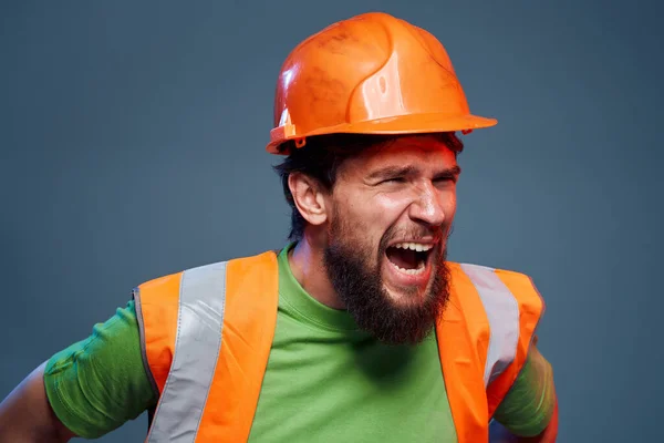 emotional worker orange hard hat construction cropped view