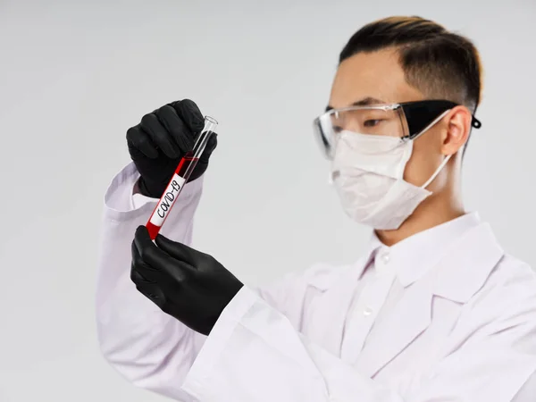 male doctor blood test black gloves medicine gray background