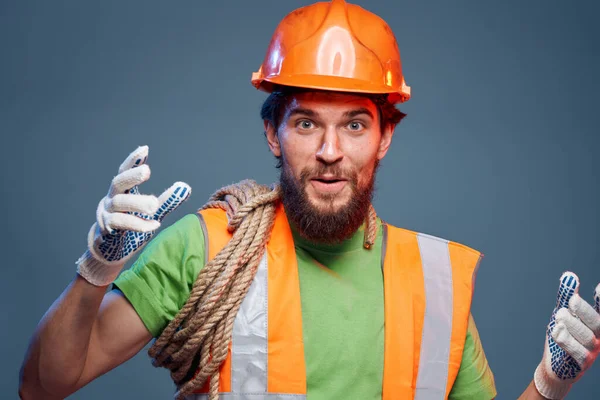 Emotional man in work uniform safety professional blue background — Stock Photo, Image