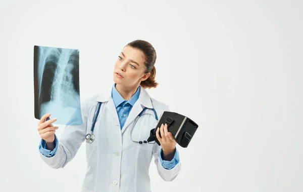 woman doctor in medical gown with x-ray new technology nurse stethoscope