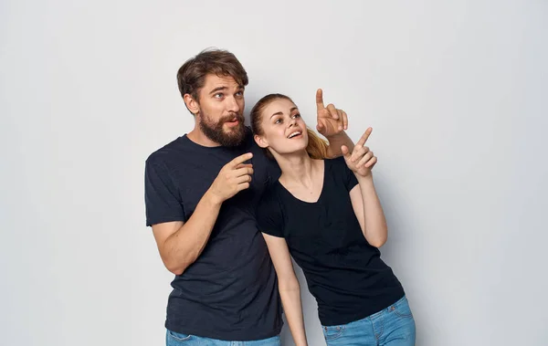 man and woman wearing black t-shirts casual clothes studio family