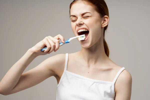 Pretty woman toothbrush hygiene oral care studio — Stock Photo, Image