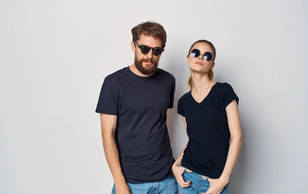 man and woman wearing black t-shirts casual clothes studio family