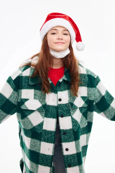 Woman in new year clothes santa hat coat white background — Stock Photo, Image