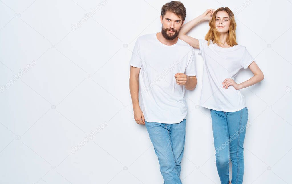 Enamored woman and man t-shirts family friends having fun gesturing with their hands