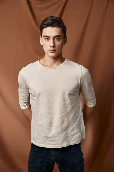 Man in white sweater fashionable hairstyle Studio fabric background lifestyle model — Stock Photo, Image