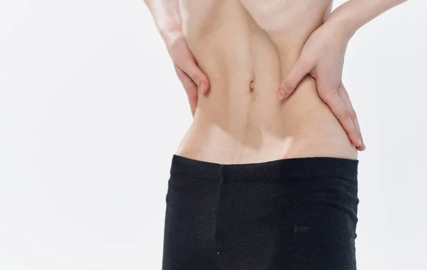 Štíhlá žena úzký pas černé legíny kalorie žebra anorexie strava — Stock fotografie