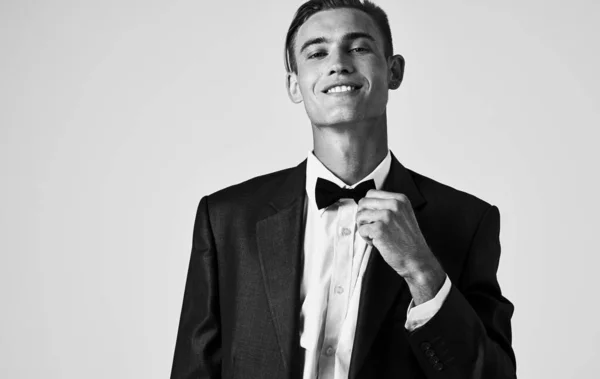 Elegant Gentleman in a classic suit with a bow tie around his neck portrait black and white photography — Stock Photo, Image