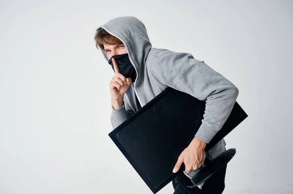 man hidden mask with hood on his head computer monitor theft stealth