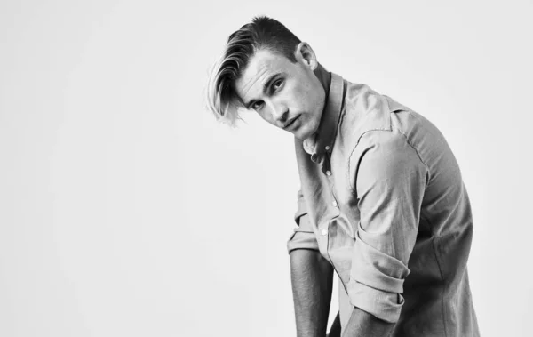 Portrait of a handsome guy in a shirt on a light background close-up portrait — Stock Photo, Image