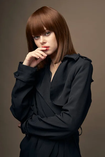 Pretty woman European appearance coat side view — Stock Photo, Image