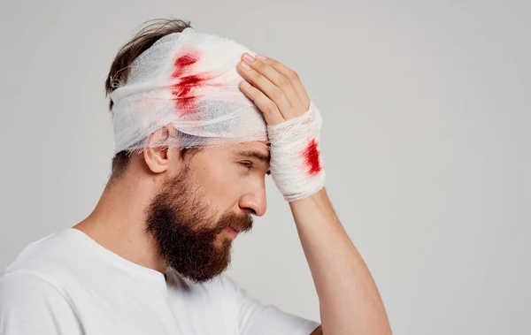 man with bandaged head health problems medicine hospital