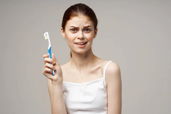 Pretty woman toothbrush hygiene oral care studio — Stock Photo, Image