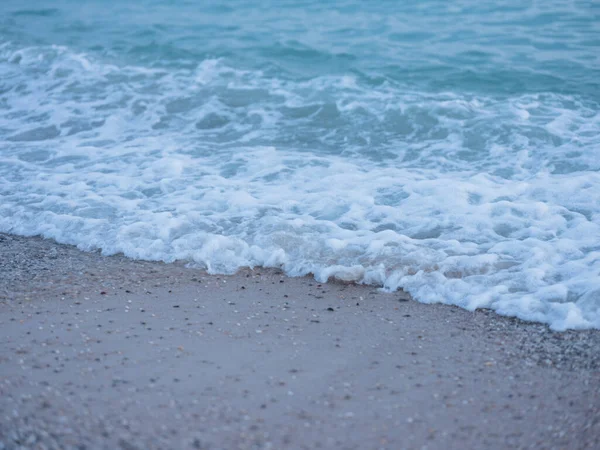 Nature ocean sunset sand beach fresh air waves white foam — Stock Photo, Image