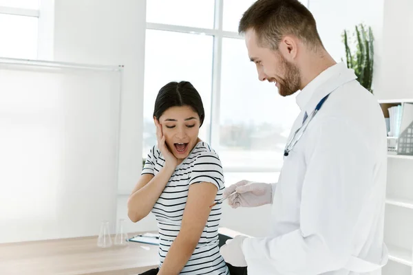 Emotional woman afraid of injections vaccination hospital treatment — Stock Photo, Image
