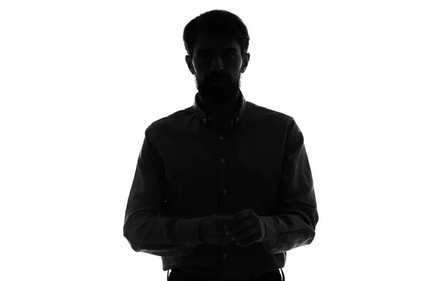 Silueta negra de un hombre sobre un fondo blanco modelo de vista recortada — Foto de Stock