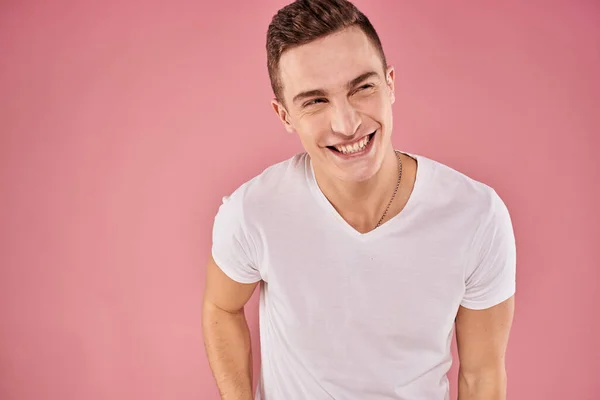 Cheerful man in white t-shirt smile emotions close-up pink background studio — Stock Photo, Image