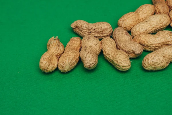 beer peanuts in shells bar alcohol green background
