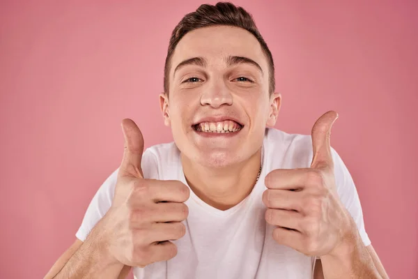 Cheerful man in white t-shirt smile emotions close-up pink background studio — Stock Photo, Image