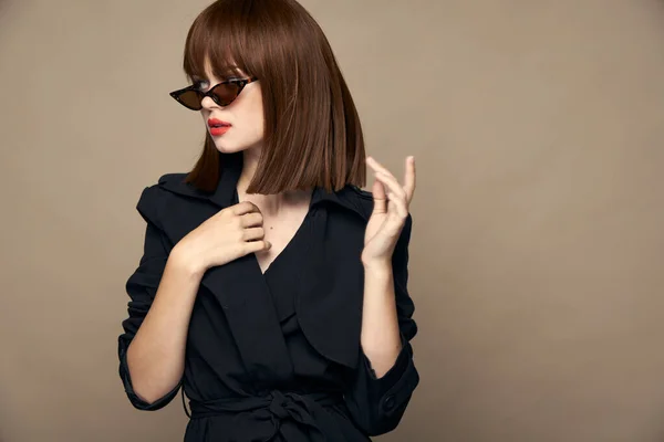 Stylish Woman Gestures with hands Copy Space black coat — Stock Photo, Image