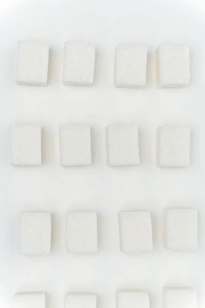 Suikerklontjes gelijkmatig verdeeld zoet ingrediënt bovenaanzicht — Stockfoto