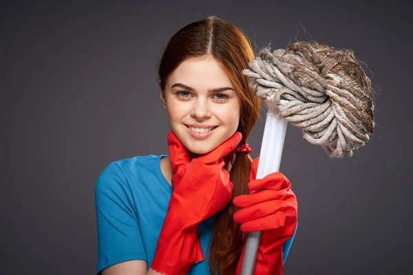 Emotional woman with a mop in hand cleaning rooms home care — Stock Photo, Image
