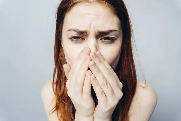 emotional woman holding hands on face emotions antics close-up