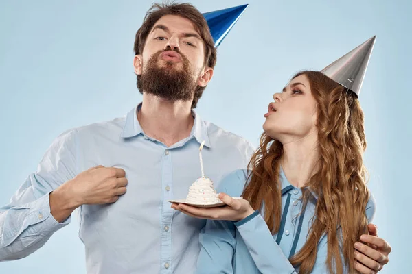 Birthday corporate young man and woman with cake on isolated background disco party — Stock Photo, Image