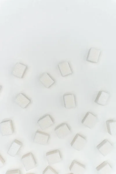 Cubes de sucre sur un fond clair Ingrédient glucose — Photo