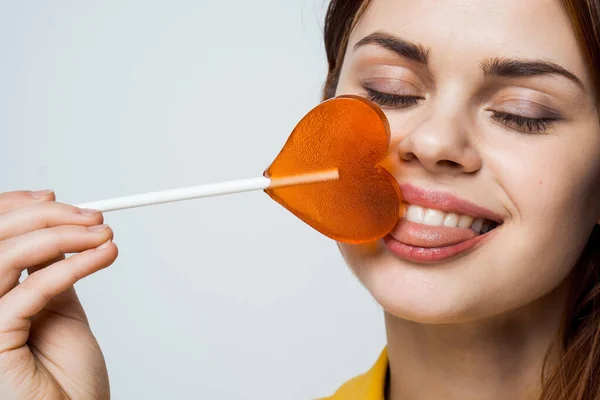 Cute red-haired woman with lollipop in her mouth glamor closeup — Stock Photo, Image