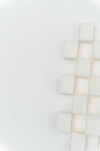 Cukr kostky vrávorající glukózy sladkosti složka lehké pozadí — Stock fotografie