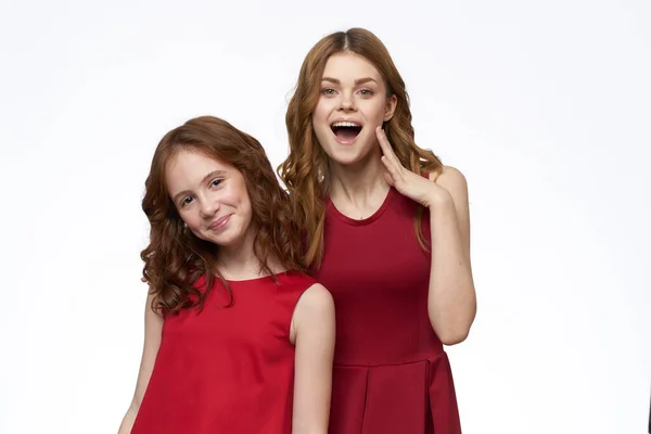 stock image Mom and daughter red dress hug family joy friendship