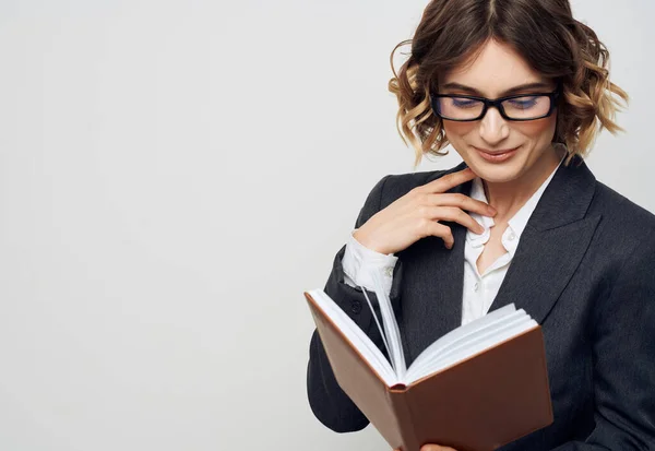 Business woman in classic suit brown book cropped view — Stock Photo, Image