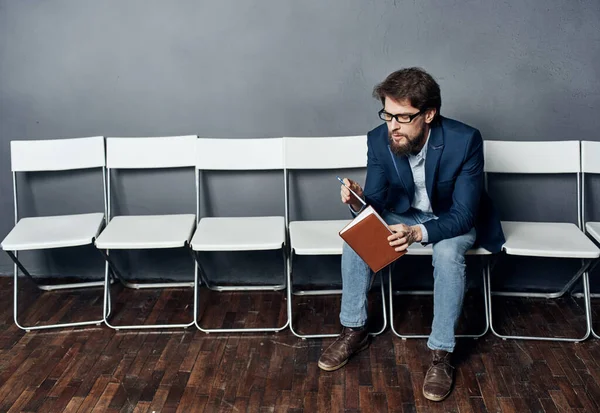 Man sitting on a chair one waiting job interview job