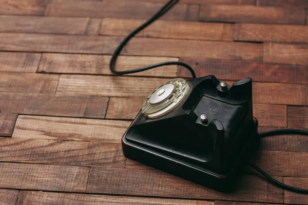 Retro telephone technology antique communication nostalgia wood floor — Stock Photo, Image