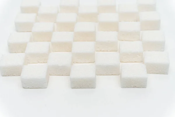 Sucre cubes échelonné bonbons ingrédient glucose lumière fond — Photo